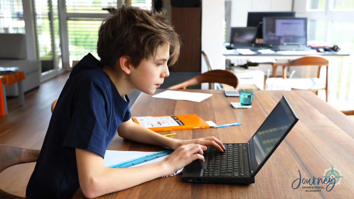 Teen boy studying physics online with Journey Homeschool Academy’s Discover Physics course
