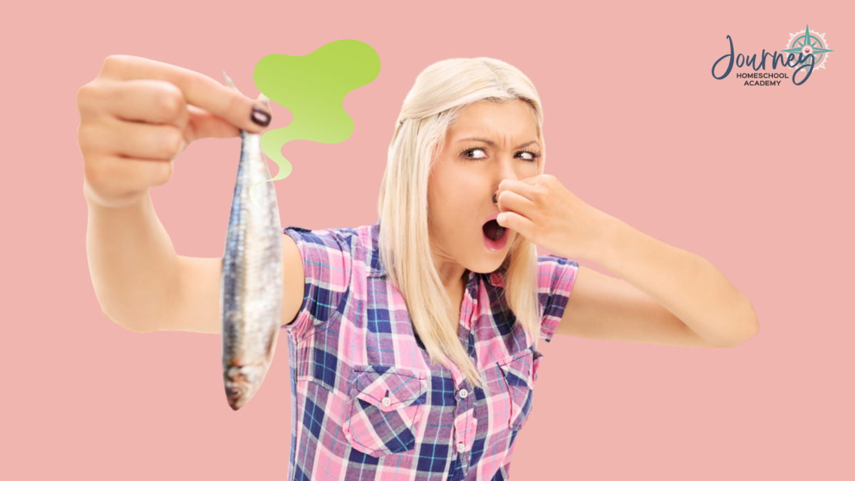 Woman holding her nose while holding a fish, representing a homeschool chemistry senses lesson on why certain smells stink, from Journey Homeschool Academy.